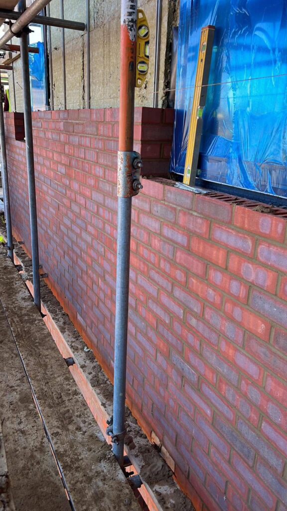 Romford: RM5 New build, brick work wall with insulation