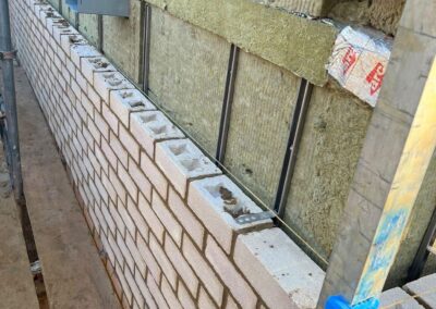 Romford: RM5  New build, brick work wall with insulation
