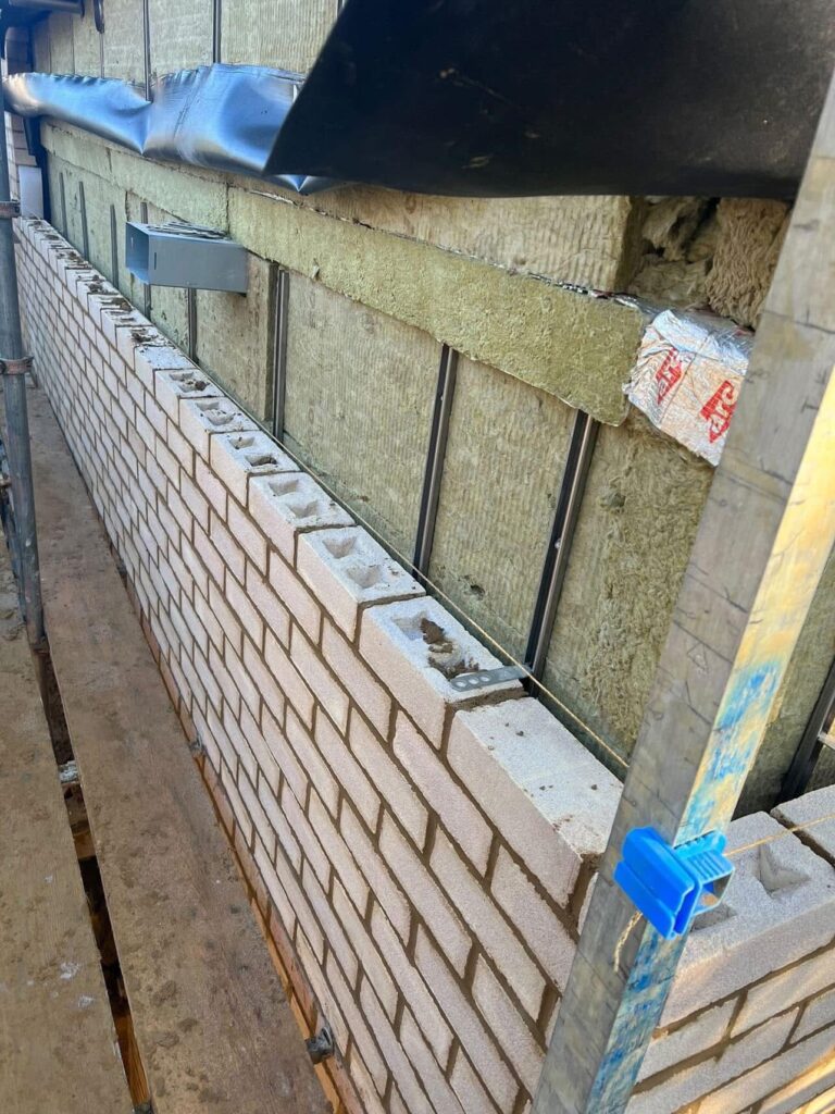 Romford: RM5 New build, brick work wall with insulation