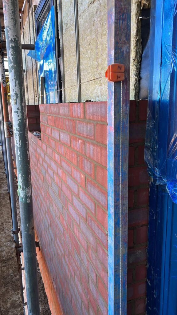 Romford: RM5 New build, brick work wall with insulation