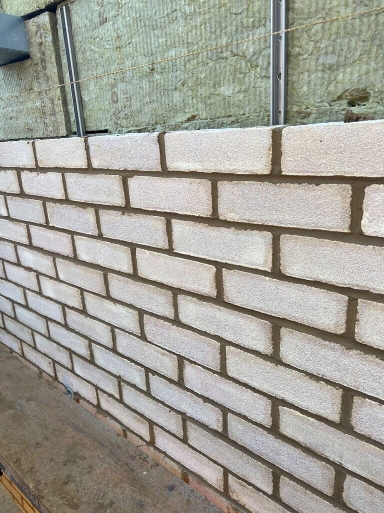 Romford: RM5 New build, brick work wall with insulation